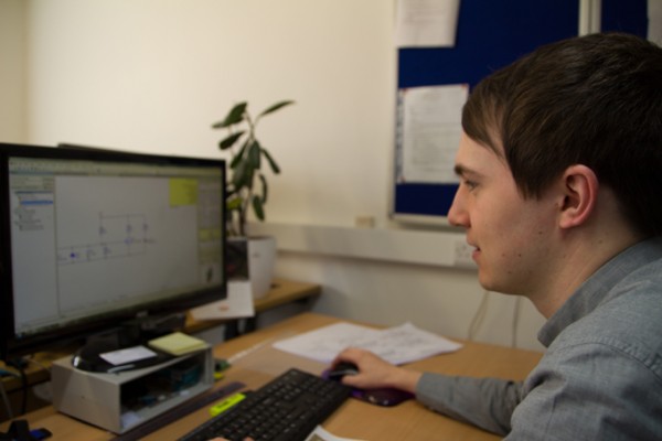 Tom Edwards at GSPK Design LTD working on a circuit board